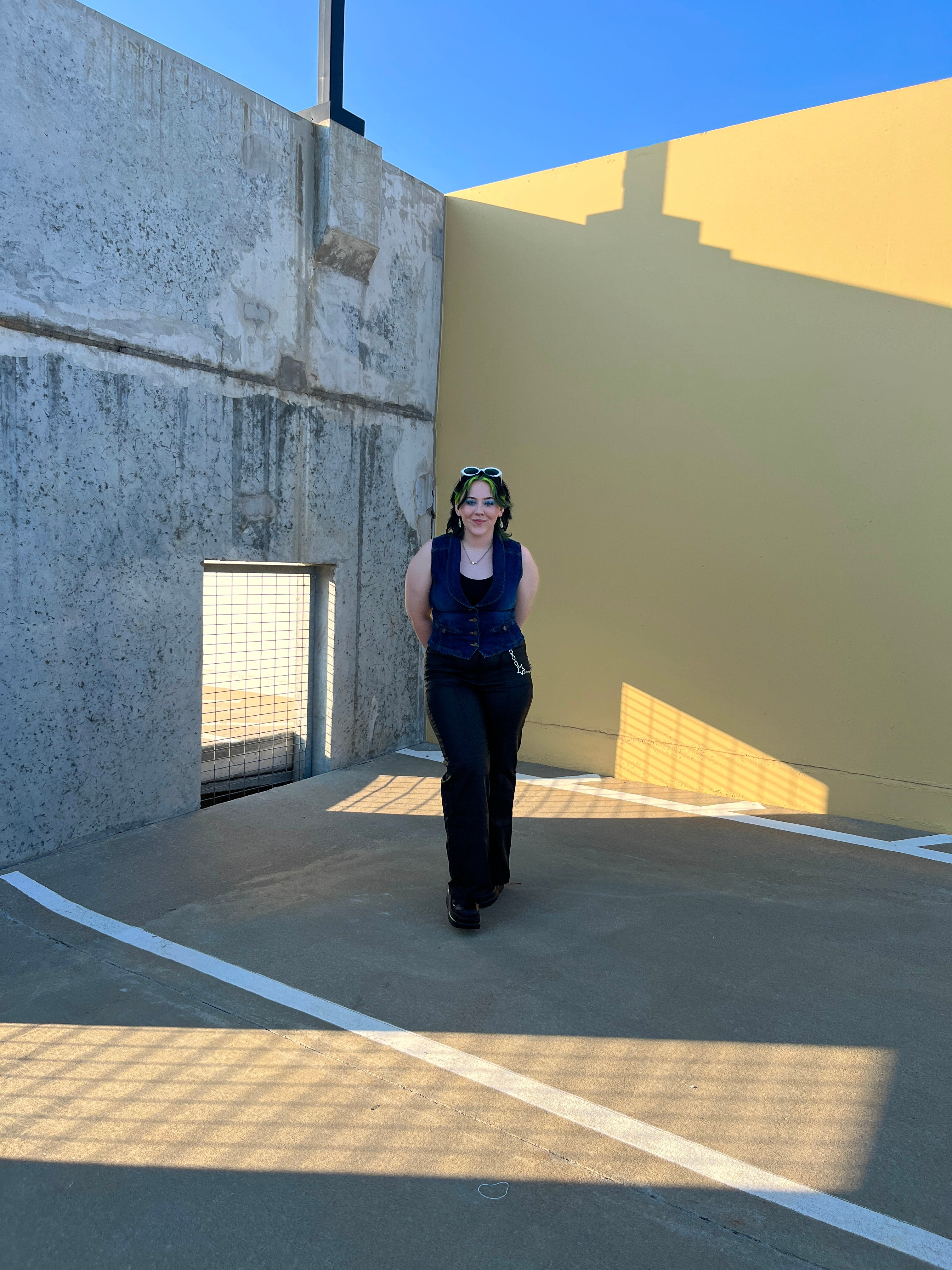 Faith standing in front of a wall
